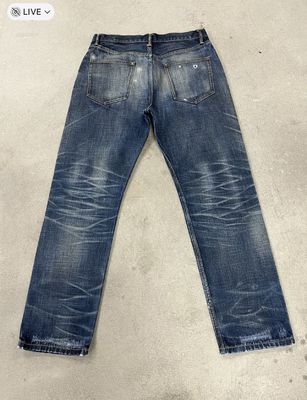 Classic Dark Wash Straight Leg Jeans With Whiskering And Fading For A Vintage Look
