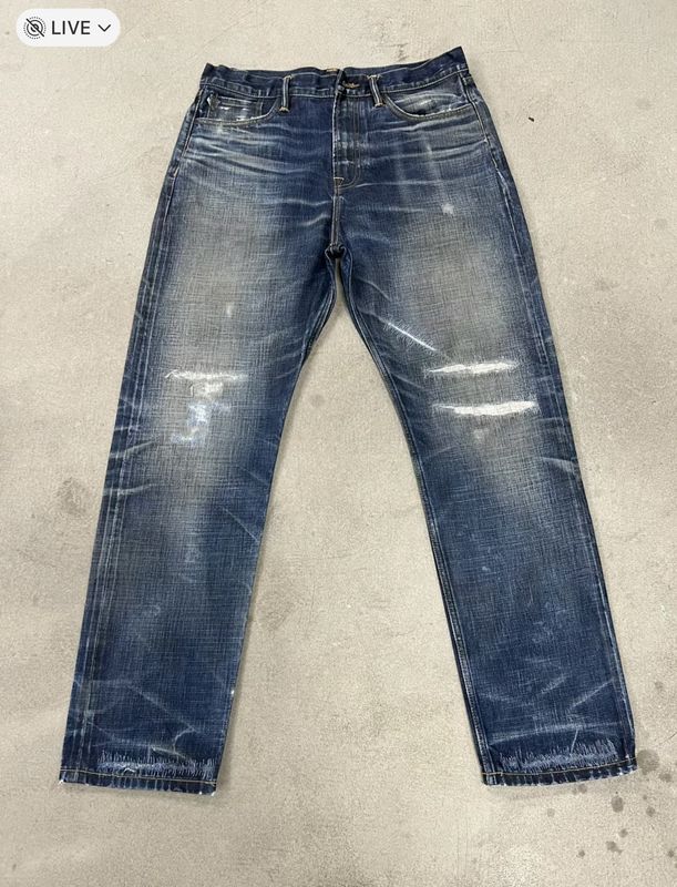 Classic Dark Wash Straight Leg Jeans With Whiskering And Fading For A Vintage Look