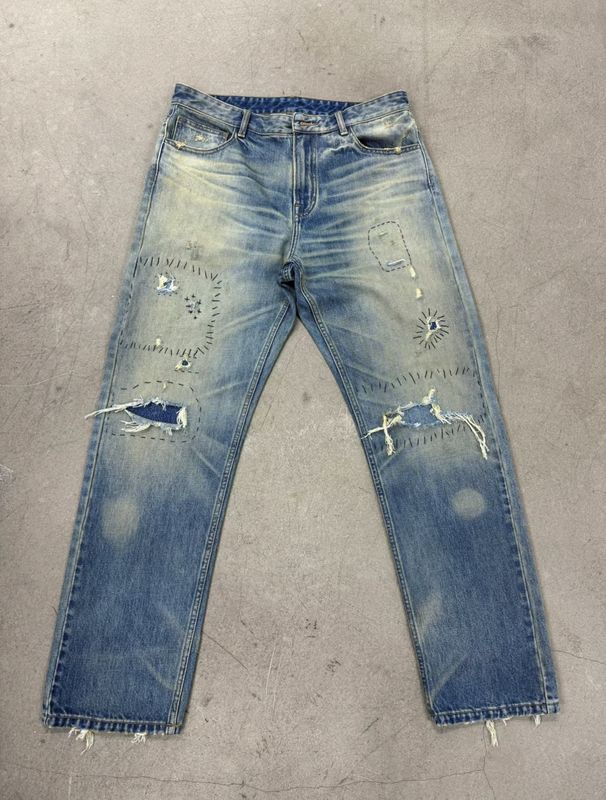 Light Wash Denim Bottom With Heavy Distressing For A Rugged Vintage Look